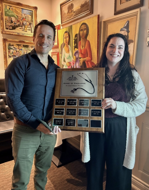 Dr. DellaVedova receiving the Excellence in Local Medical Education Award with Dr. Duffus